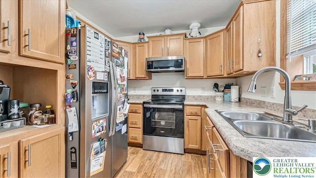 3954 Cedar Dr, Lehigh Twp, PA 18088 - kitchen with stainless steel appliances, light countertops, light wood-style flooring, and light brown cabinets