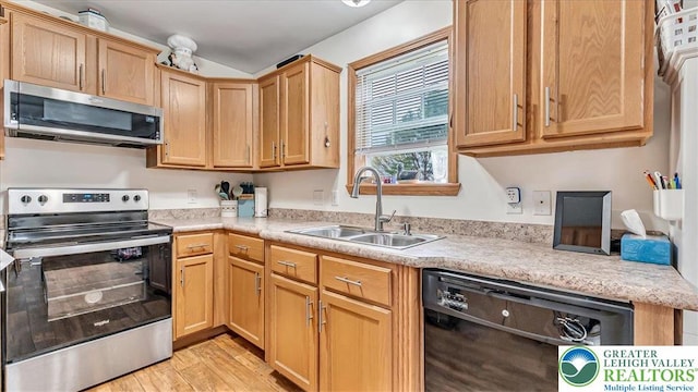 3954 Cedar Dr, Lehigh Twp, PA 18088 - kitchen with stainless steel appliances, light countertops, light wood-style flooring, and light brown cabinets
