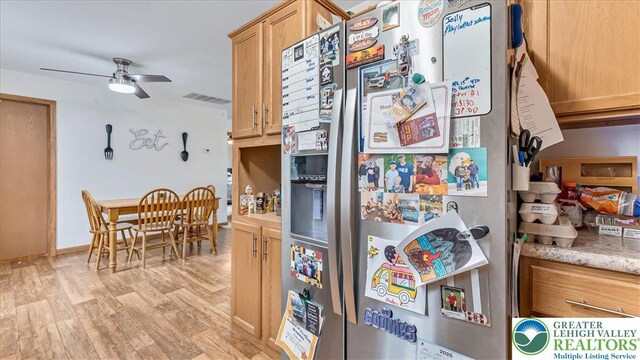 3954 Cedar Dr, Lehigh Twp, PA 18088 - kitchen with stainless steel fridge with ice dispenser, ceiling fan, light wood-type flooring, and light stone counters
