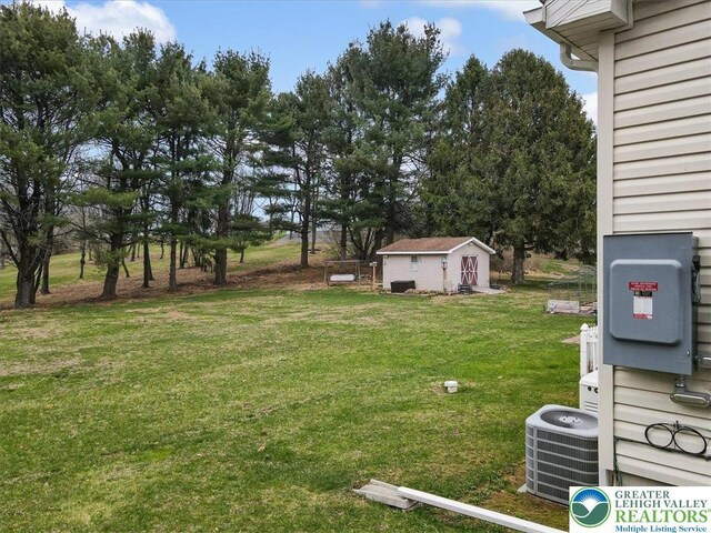 3954 Cedar Dr, Lehigh Twp, PA 18088 - view of green lawn with an outdoor structure and view of scattered trees