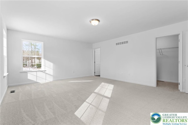718 Rte 314 Unit 2, Pocono Twp, PA 18370 - unfurnished bedroom with carpet floors, a spacious closet, and a closet