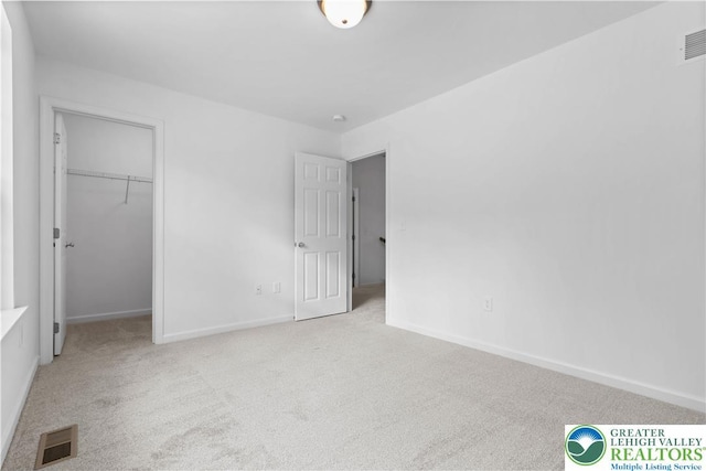 718 Rte 314 Unit 2, Pocono Twp, PA 18370 - unfurnished bedroom with carpet, a spacious closet, and a closet