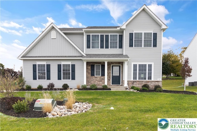 718 Rte 314 Unit 2, Pocono Twp, PA 18370 - view of front of house featuring stone siding, a front yard, board and batten siding, and roof with shingles