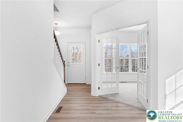 718 Rte 314 Unit 2, Pocono Twp, PA 18370 - hallway featuring wood finished floors, stairway, and french doors