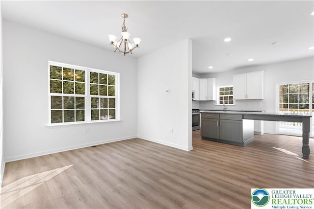 718 Rte 314 Unit 2, Pocono Twp, PA 18370 - kitchen with healthy amount of natural light, stainless steel appliances, a chandelier, light wood finished floors, and recessed lighting