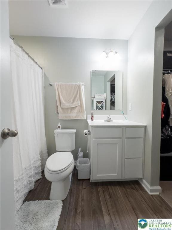 403 Lock Dr, Allen Twp, PA 18067 - bathroom featuring wood finished floors, vanity, and curtained shower