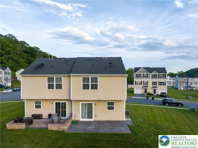 403 Lock Dr, Allen Twp, PA 18067 - back of property with a patio, a lawn, and a residential view