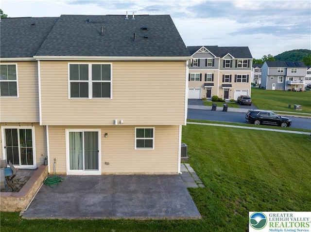 403 Lock Dr, Allen Twp, PA 18067 - rear view of property with a lawn, a patio, and a residential view