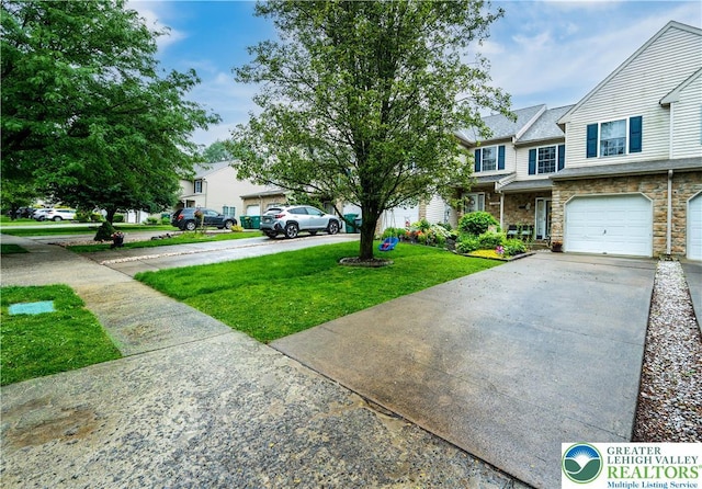 1778 Pinewind Dr, Alburtis Boro, PA 18011 - view of front of house with driveway, a front lawn, and stone siding