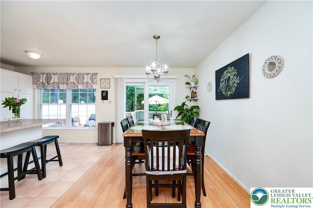 1778 Pinewind Dr, Alburtis Boro, PA 18011 - dining space featuring a chandelier, healthy amount of natural light, and light wood-style flooring
