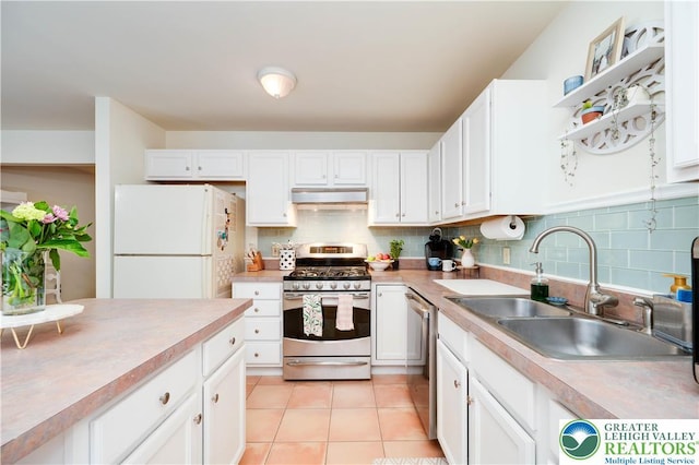 1778 Pinewind Dr, Alburtis Boro, PA 18011 - kitchen featuring stainless steel appliances, light countertops, white cabinetry, and under cabinet range hood