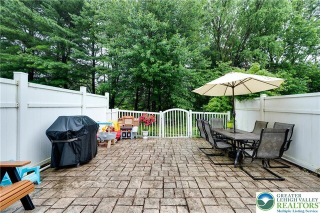 1778 Pinewind Dr, Alburtis Boro, PA 18011 - view of patio / terrace with a grill, outdoor dining area, and view of scattered trees