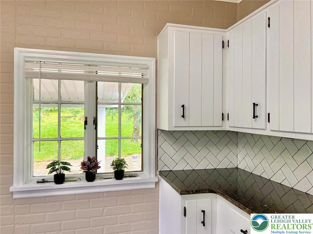 737 Frost Hollow Rd, Easton, PA 18040 - kitchen featuring dark countertops, backsplash, and white cabinetry