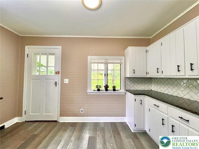 737 Frost Hollow Rd, Easton, PA 18040 - kitchen with dark countertops, wood finished floors, tasteful backsplash, crown molding, and white cabinets