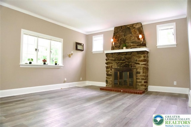 737 Frost Hollow Rd, Easton, PA 18040 - unfurnished living room featuring wood finished floors, crown molding, and a stone fireplace