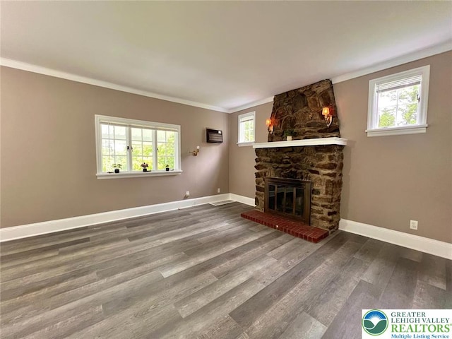 737 Frost Hollow Rd, Easton, PA 18040 - unfurnished living room featuring ornamental molding, a stone fireplace, and wood finished floors