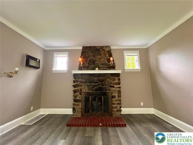 737 Frost Hollow Rd, Easton, PA 18040 - unfurnished living room featuring crown molding, wood finished floors, healthy amount of natural light, and a stone fireplace