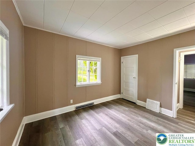 737 Frost Hollow Rd, Easton, PA 18040 - unfurnished bedroom with wood finished floors, a decorative wall, and crown molding