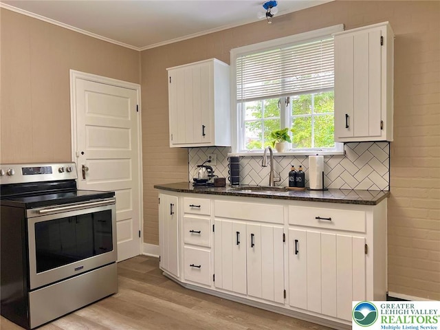 737 Frost Hollow Rd, Easton, PA 18040 - kitchen with electric range, light wood-style floors, backsplash, white cabinetry, and dark stone counters