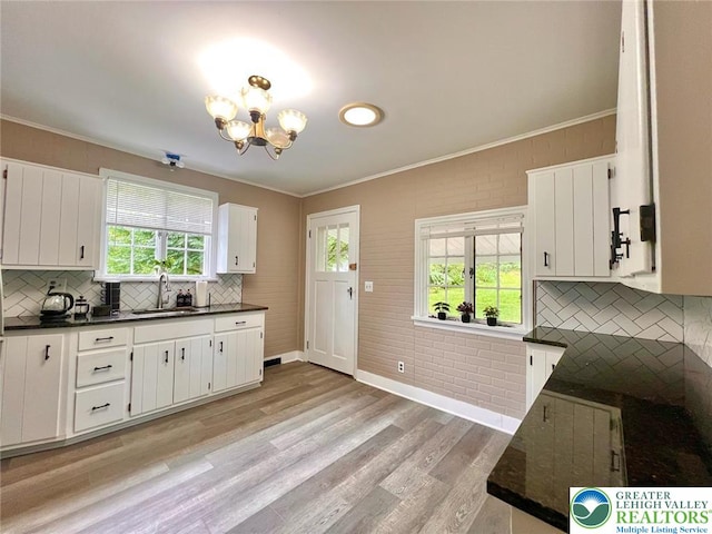 737 Frost Hollow Rd, Easton, PA 18040 - kitchen with dark countertops, crown molding, tasteful backsplash, and healthy amount of natural light