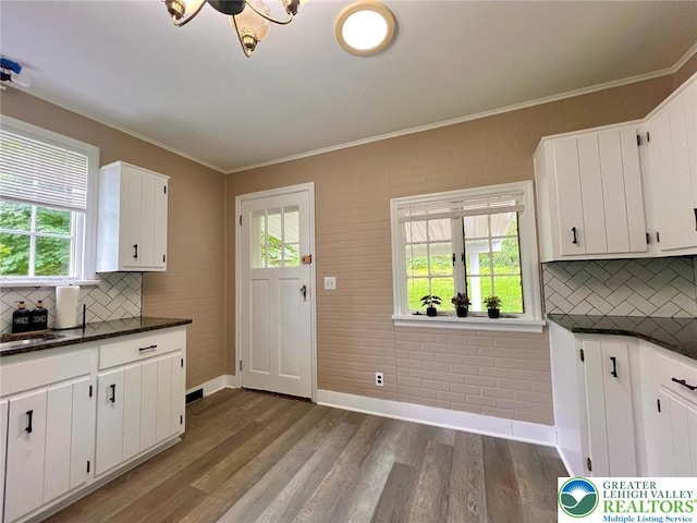 737 Frost Hollow Rd, Easton, PA 18040 - kitchen with healthy amount of natural light, backsplash, dark wood-style floors, and crown molding