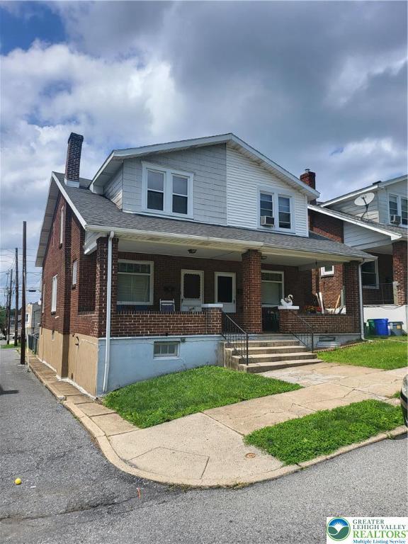 419 E Walnut St, Allentown City, PA 18109 - view of front of property with a chimney, brick siding, and covered porch