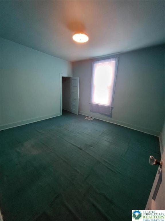 419 E Walnut St, Allentown City, PA 18109 - carpeted empty room with baseboards