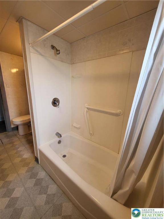 419 E Walnut St, Allentown City, PA 18109 - full bath with shower / bath combination with curtain and tile patterned floors