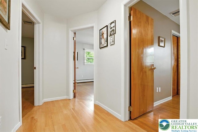 627 Columbia Ave, Palmerton Boro, PA 18071 - hall with light wood finished floors, a baseboard radiator, and a baseboard heating unit