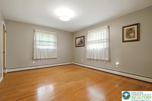 627 Columbia Ave, Palmerton Boro, PA 18071 - spare room featuring wood finished floors and a baseboard radiator