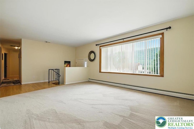 627 Columbia Ave, Palmerton Boro, PA 18071 - spare room with a baseboard heating unit and carpet floors