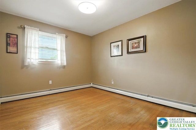 627 Columbia Ave, Palmerton Boro, PA 18071 - unfurnished room with wood finished floors and a baseboard heating unit
