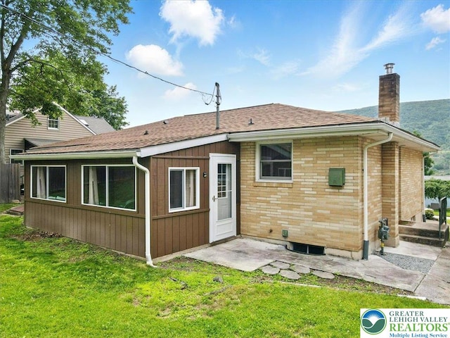 627 Columbia Ave, Palmerton Boro, PA 18071 - back of property with a chimney, a yard, and a shingled roof