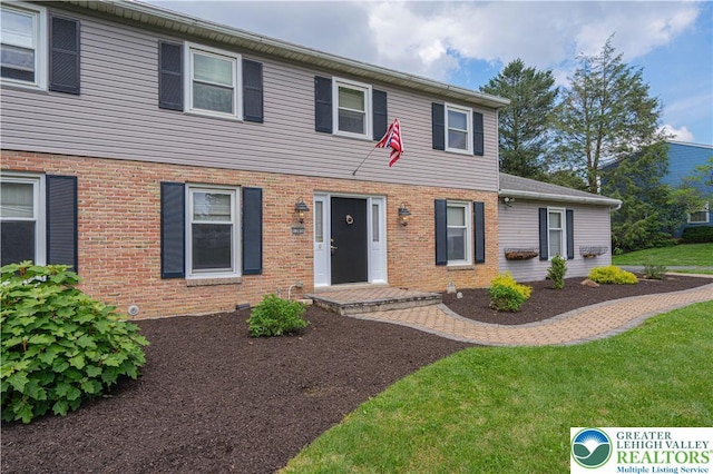 1265 Clearview Cir, Lower Macungie Twp, PA 18103 - view of front of property with brick siding and a front lawn