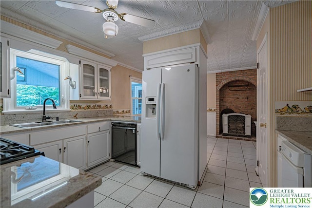 1265 Clearview Cir, Lower Macungie Twp, PA 18103 - kitchen featuring white appliances, a brick fireplace, light tile patterned floors, glass insert cabinets, and white cabinetry