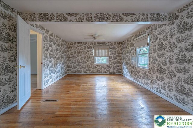 1265 Clearview Cir, Lower Macungie Twp, PA 18103 - spare room with wallpapered walls, wood finished floors, and ceiling fan