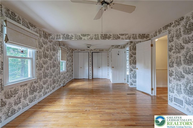 1265 Clearview Cir, Lower Macungie Twp, PA 18103 - unfurnished room featuring wallpapered walls, light wood-type flooring, and ceiling fan