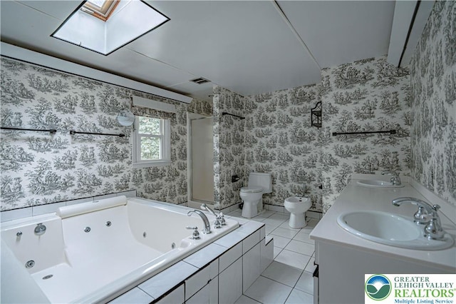 1265 Clearview Cir, Lower Macungie Twp, PA 18103 - bathroom with a jetted tub, a skylight, wallpapered walls, tile patterned floors, and a bidet
