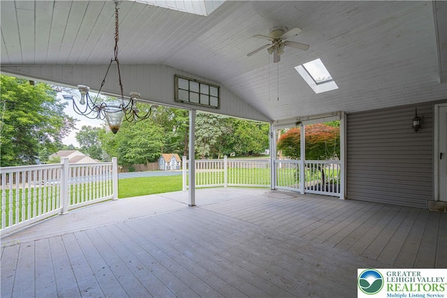 1265 Clearview Cir, Lower Macungie Twp, PA 18103 - wooden deck with a ceiling fan, a storage unit, and a lawn