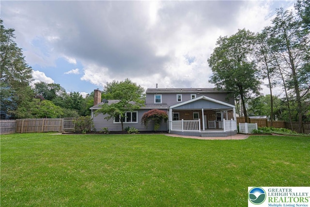 1265 Clearview Cir, Lower Macungie Twp, PA 18103 - back of house featuring a fenced backyard, a chimney, and a patio area