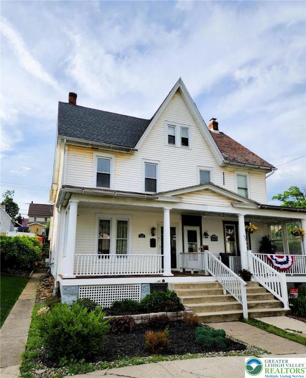 233 Lafayette Ave, Palmerton Boro, PA 18071 - view of front facade with a chimney and covered porch
