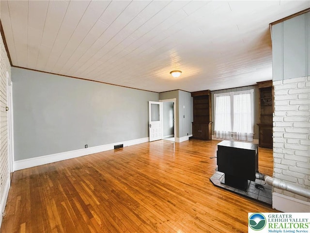 233 Lafayette Ave, Palmerton Boro, PA 18071 - unfurnished living room featuring baseboards and hardwood / wood-style floors