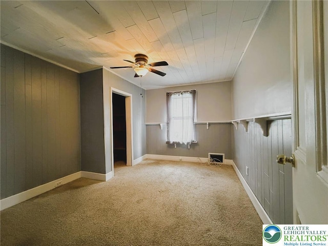 233 Lafayette Ave, Palmerton Boro, PA 18071 - empty room featuring ceiling fan, carpet floors, wood walls, and wooden ceiling
