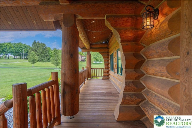 379 Meyer Rd, Bushkill Twp, PA 18064 - wooden porch featuring a lawn