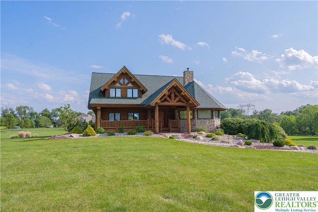 379 Meyer Rd, Bushkill Twp, PA 18064 - log home featuring a chimney, a front yard, a porch, and stone siding