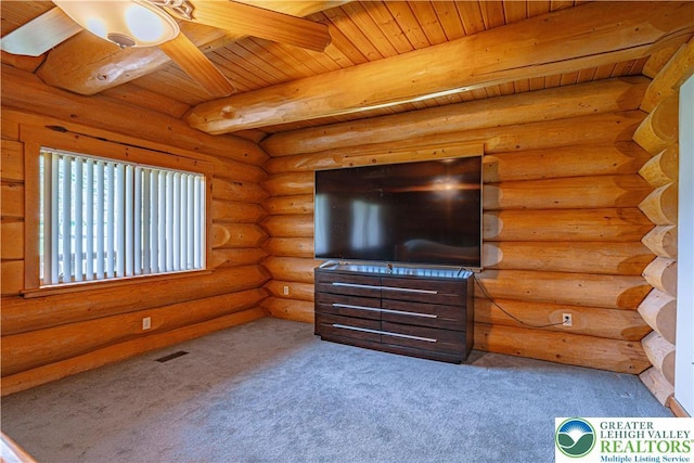 379 Meyer Rd, Bushkill Twp, PA 18064 - unfurnished living room with carpet, a wood ceiling with exposed beams, log walls, and ceiling fan
