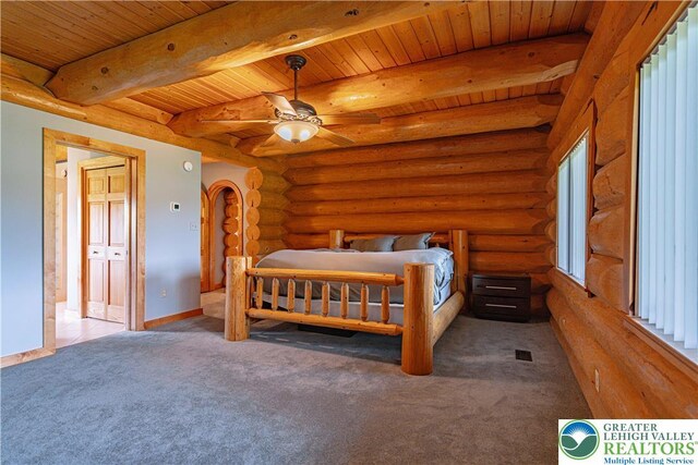 379 Meyer Rd, Bushkill Twp, PA 18064 - bedroom with a wooden ceiling with exposed beams, rustic walls, carpet, and arched walkways