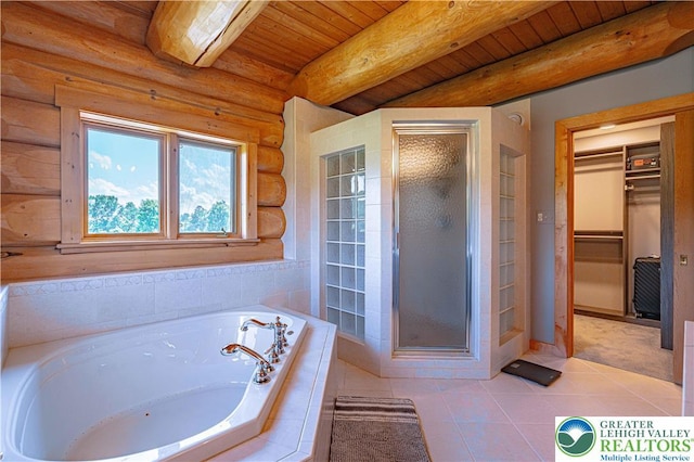 379 Meyer Rd, Bushkill Twp, PA 18064 - bathroom featuring a garden tub, a shower stall, a walk in closet, a wooden ceiling with exposed beams, and tile patterned flooring