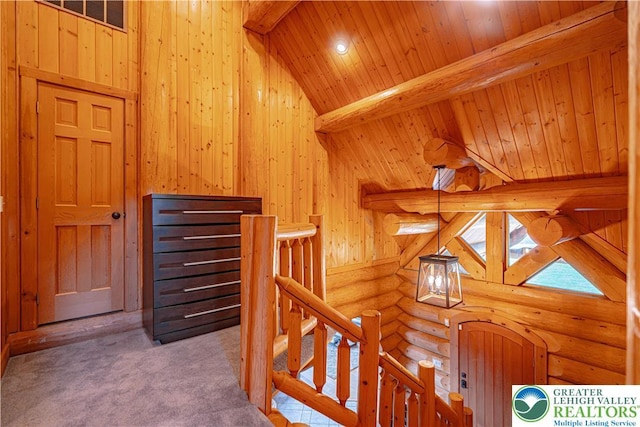 379 Meyer Rd, Bushkill Twp, PA 18064 - corridor featuring an upstairs landing, rustic walls, wood ceiling, wood walls, and carpet floors