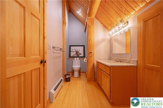 379 Meyer Rd, Bushkill Twp, PA 18064 - bathroom with a baseboard radiator, lofted ceiling, wood finished floors, vanity, and wood ceiling